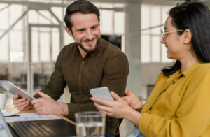 People talking and holding devices